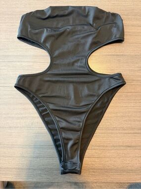 Sleek Black Cutout Bodysuit with High-Cut Leg